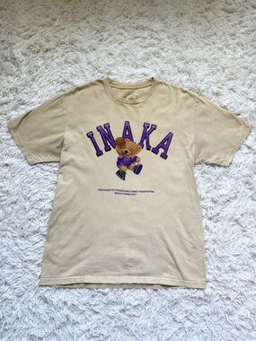 Inaka Power Beige Tee with Purple Lettering and Bear Graphic